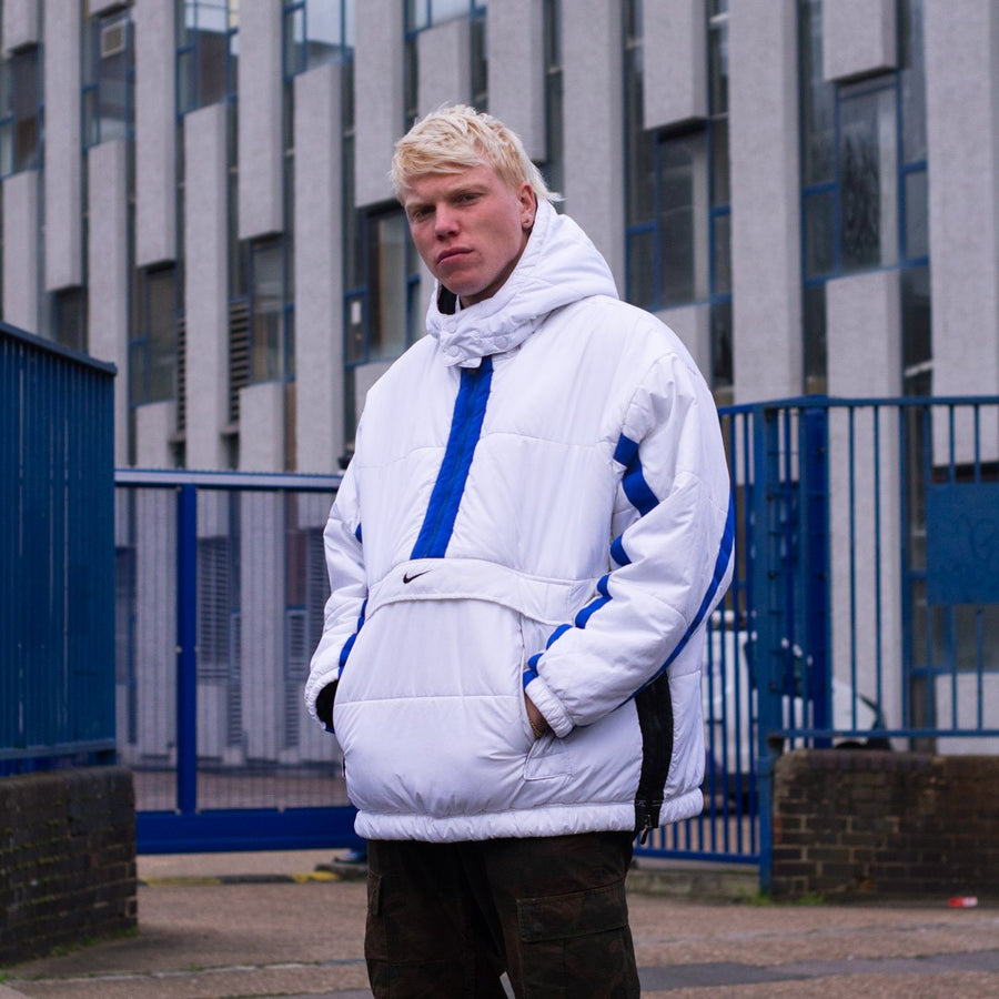 Nike quarter zip puffer pullover in white, blue and black