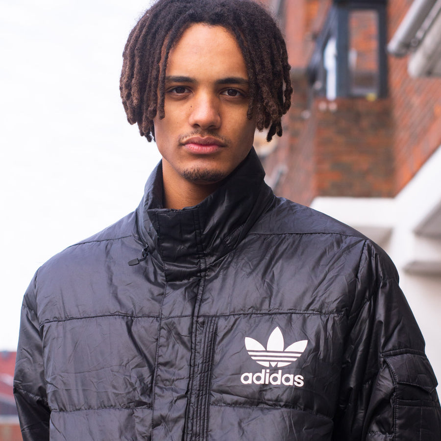 Adidas puffer jacket in black and white.