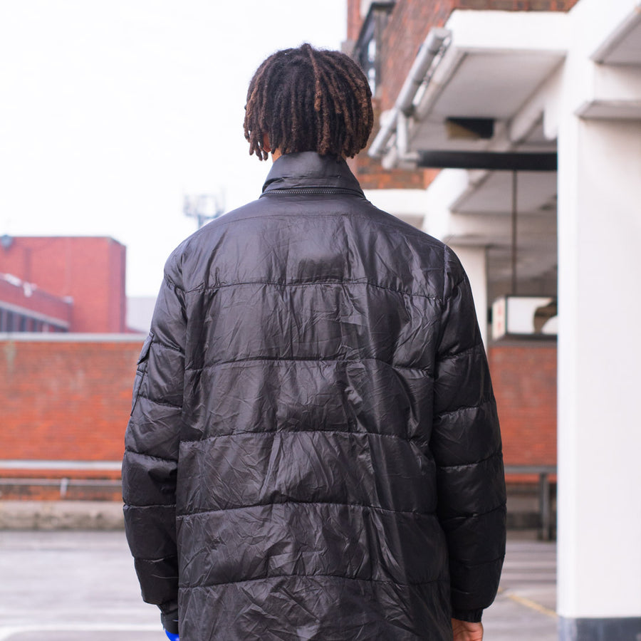 Adidas puffer jacket in black and white.