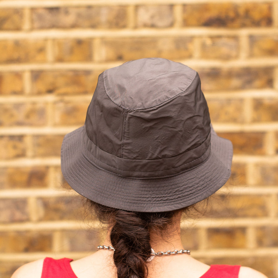 Woolrich Metal Spellout Bucket Hat in a Dark Grey