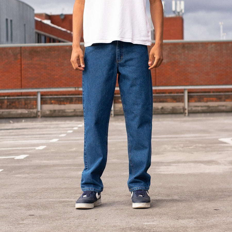 Carhartt 90's Back Pocket Logo Straight Legged Denim Jeans in Dark Blue