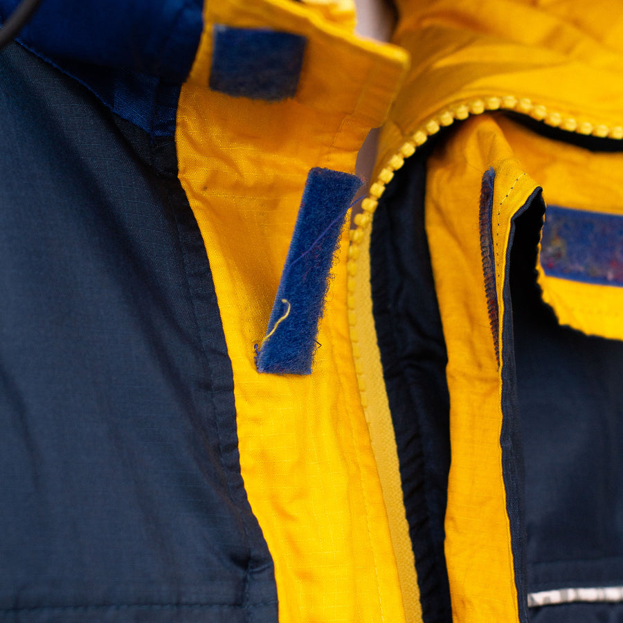 Tommy Hilfiger 90's Patch Logo Down Puffer Jacket in Two Tone Blue, Yellow and White