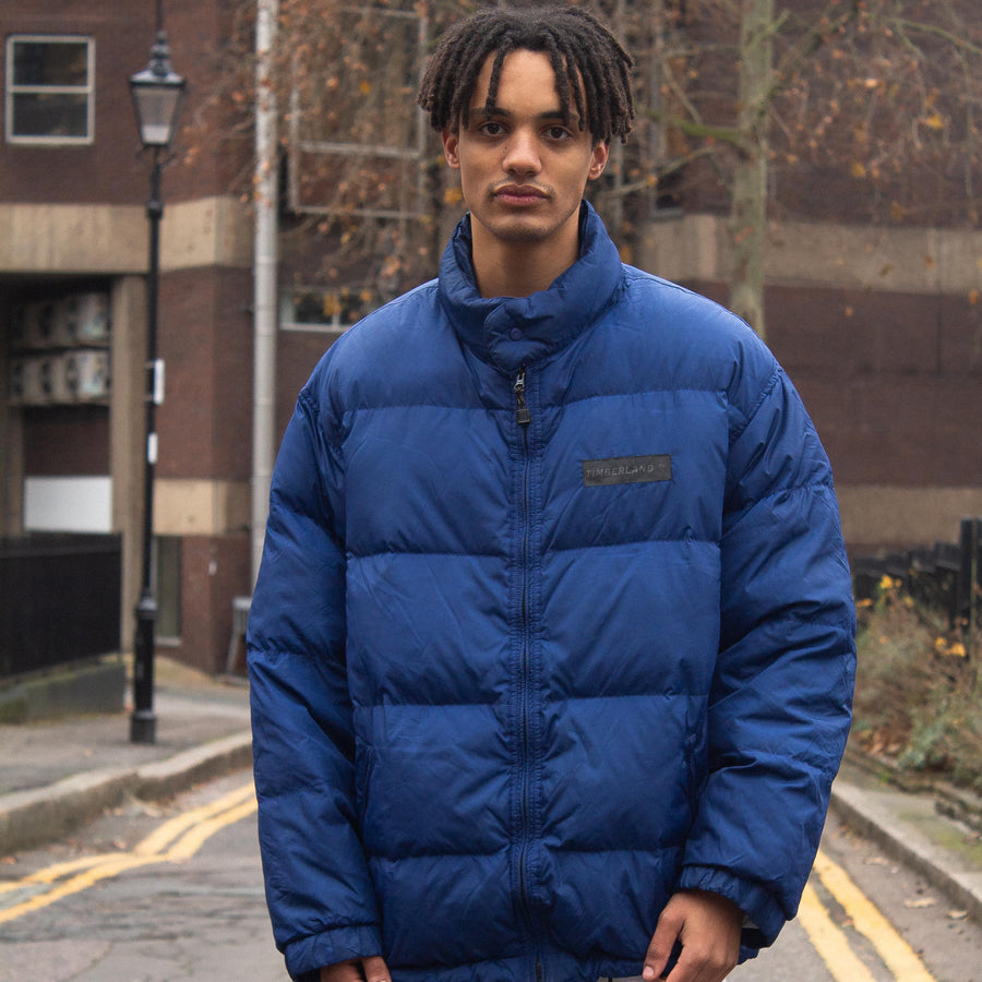 Timberland 90's Rubber Spellout Down Puffer Jacket in Blue and Black