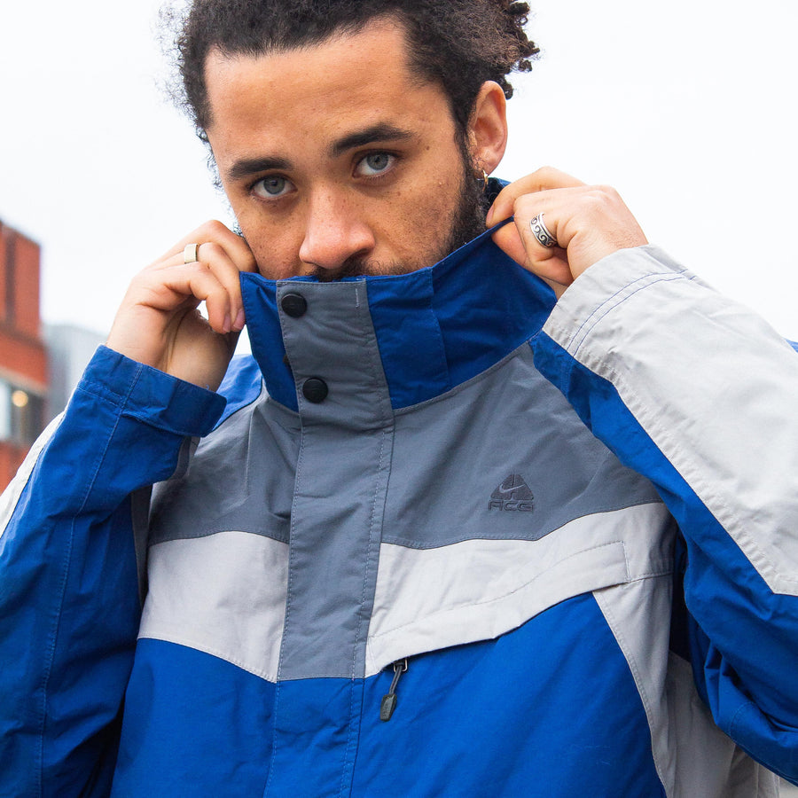 Nike ACG 00's Embroidered Logo Waterproof StormFit Jacket in Blue and Two Tone Grey